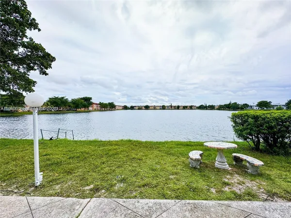 a view of a lake with a big yard