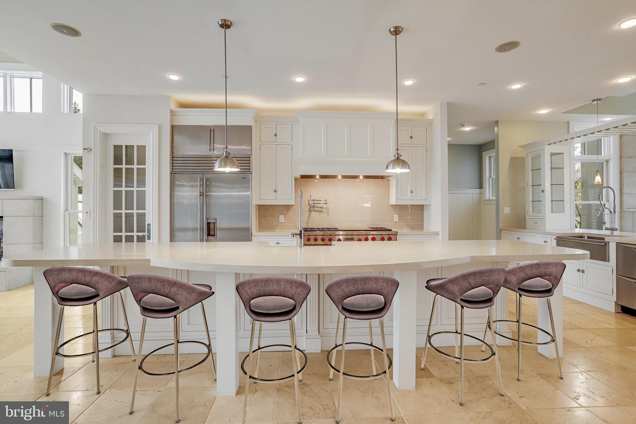 21612 Ripplemead Drive Gaithersburg, MD 20882 - Photo 2 of 39 a kitchen with sink a refrigerator and chairs