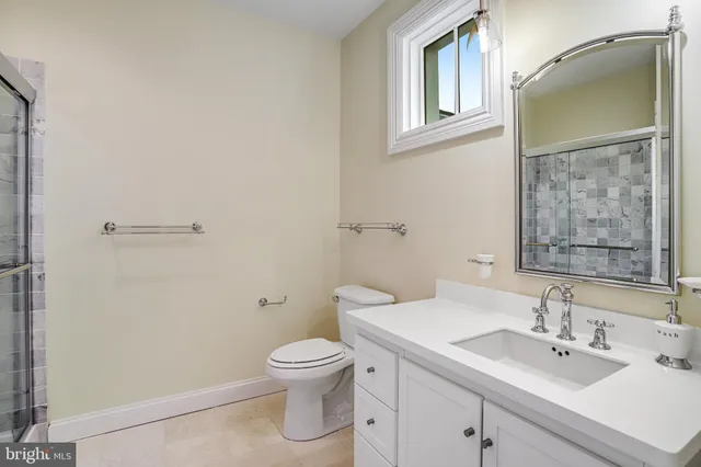 a bathroom with a sink toilet and vanity
