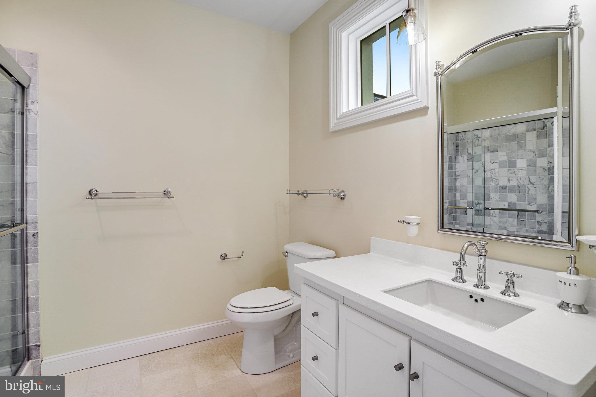 21612 Ripplemead Drive Gaithersburg, MD 20882 - Photo 21 of 39 a bathroom with a sink toilet and vanity