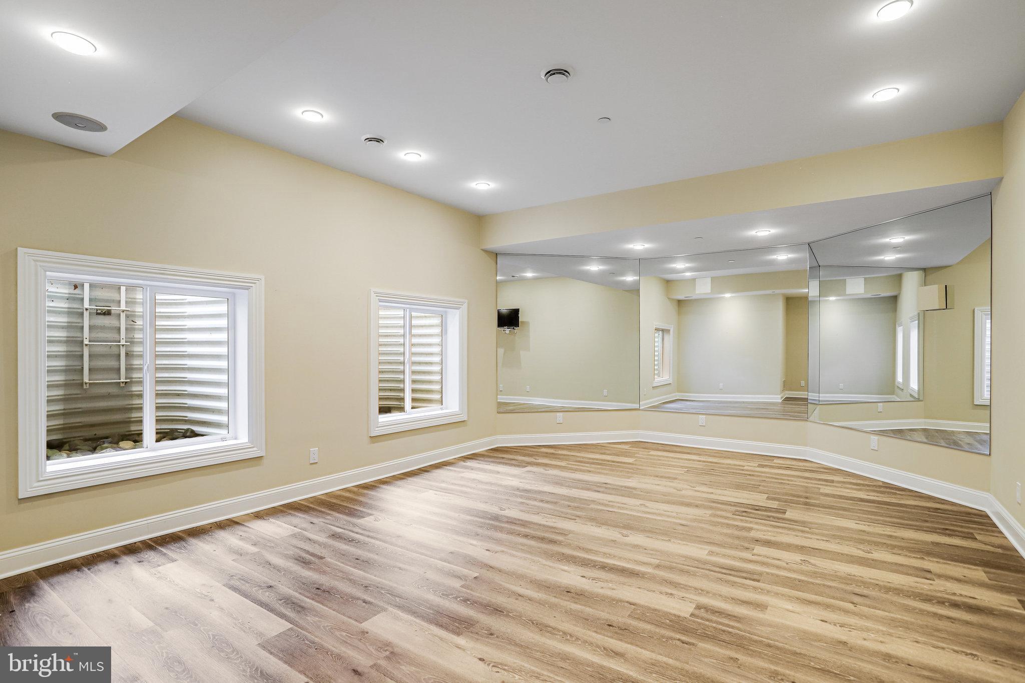21612 Ripplemead Drive Gaithersburg, MD 20882 - Photo 24 of 39 a view of an empty room with wooden floor and a window