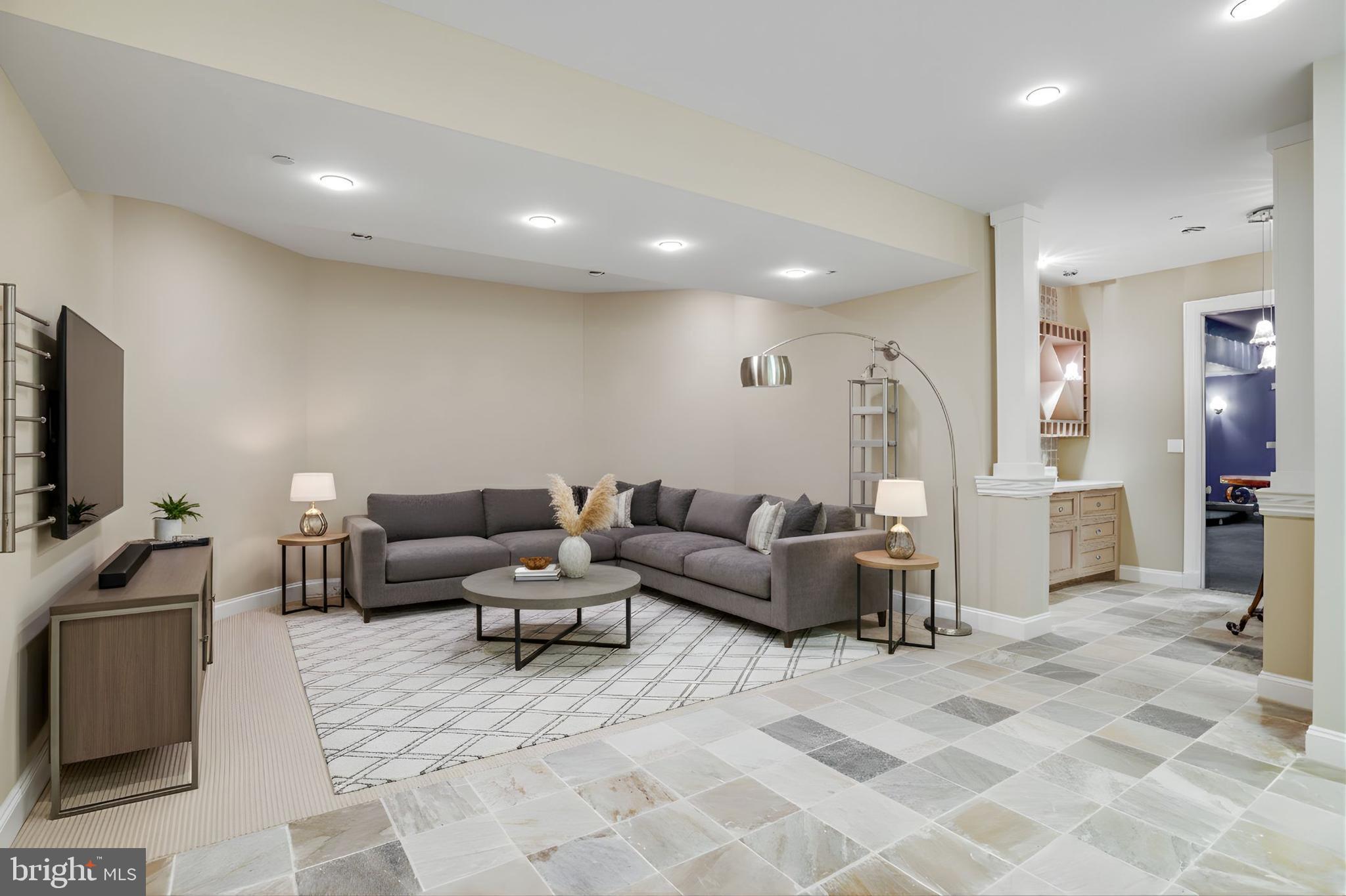 21612 Ripplemead Drive Gaithersburg, MD 20882 - Photo 27 of 39 a living room with furniture and a flat screen tv
