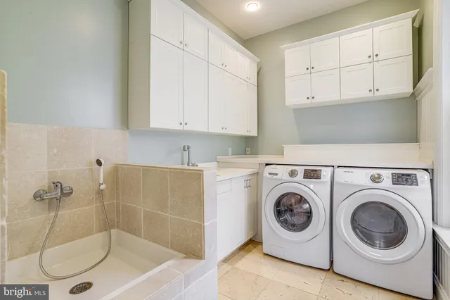 a utility room with dryer and washer