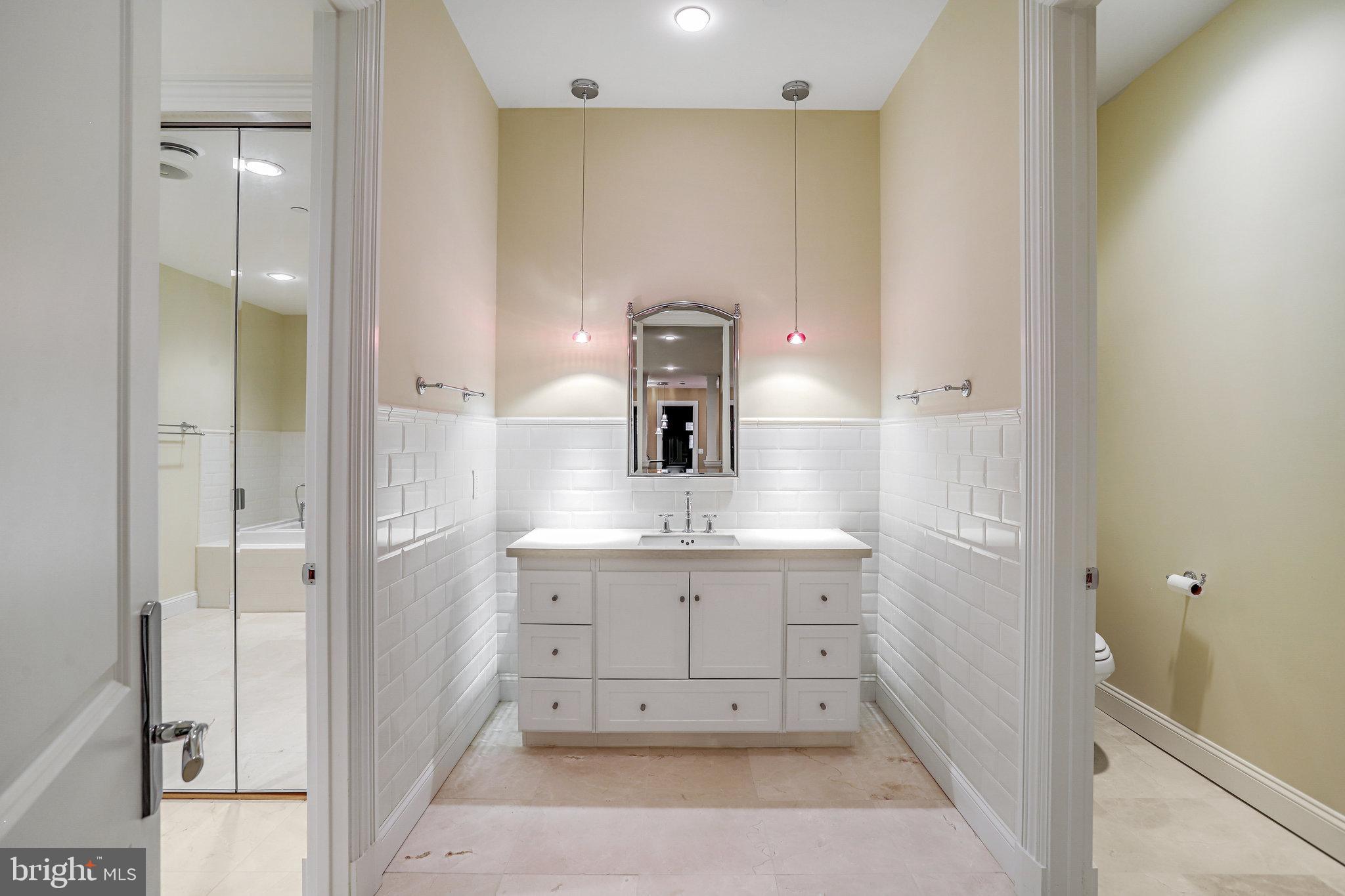 21612 Ripplemead Drive Gaithersburg, MD 20882 - Photo 30 of 39 a bathroom with a sink a mirror and vanity