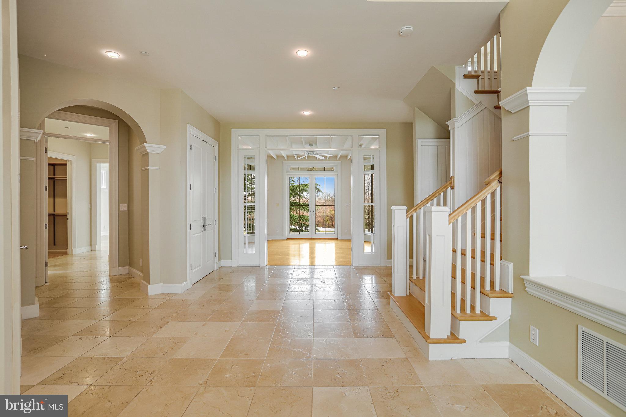 21612 Ripplemead Drive Gaithersburg, MD 20882 - Photo 7 of 39 a view of a hallway with wooden floor and windows