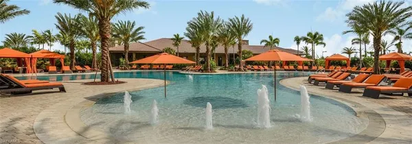 a view of a swimming pool with lounge chairs
