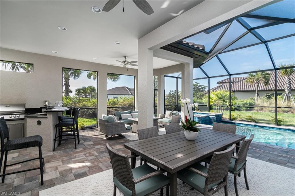 9451 Montelanico Loop Naples, FL 34119 - Photo 2 of 15 a view of a dining room with furniture window and outside view