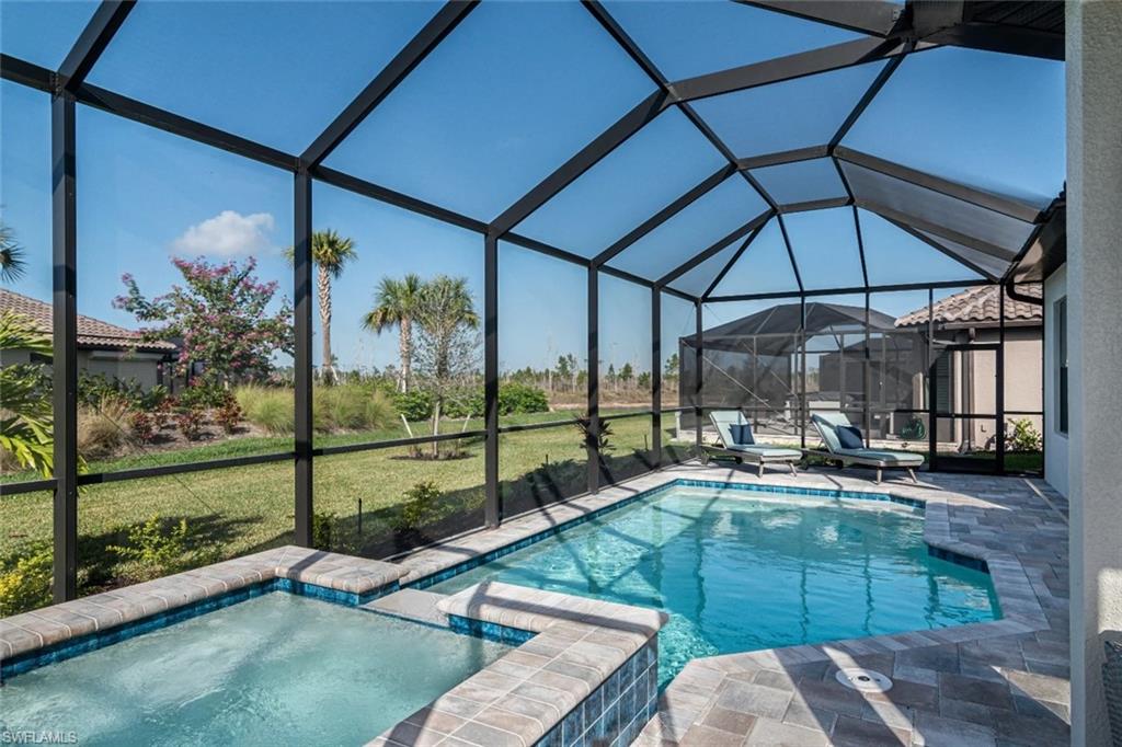 9451 Montelanico Loop Naples, FL 34119 - Photo 3 of 15 a view of a couches in patio of a house