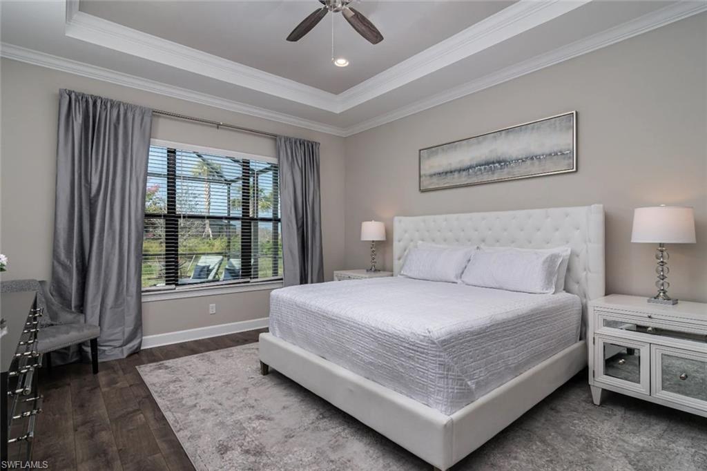9451 Montelanico Loop Naples, FL 34119 - Photo 8 of 15 a bedroom with a bed and a window