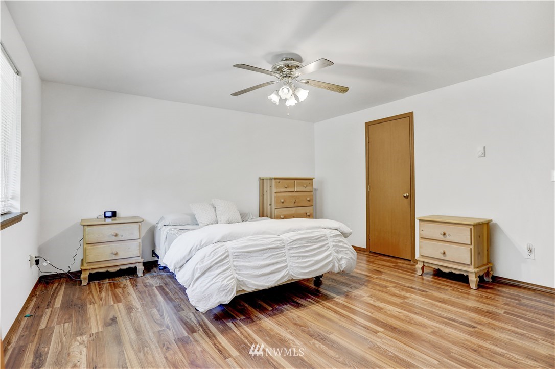 46040 Southeast Edgewick Road North Bend, WA 98045 - Photo 12 of 19 a bedroom with a bed and a chandelier