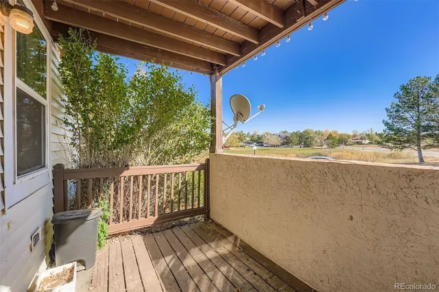 a view of a two chairs in the balcony