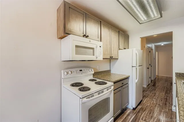 a kitchen with a stove microwave and refrigerator