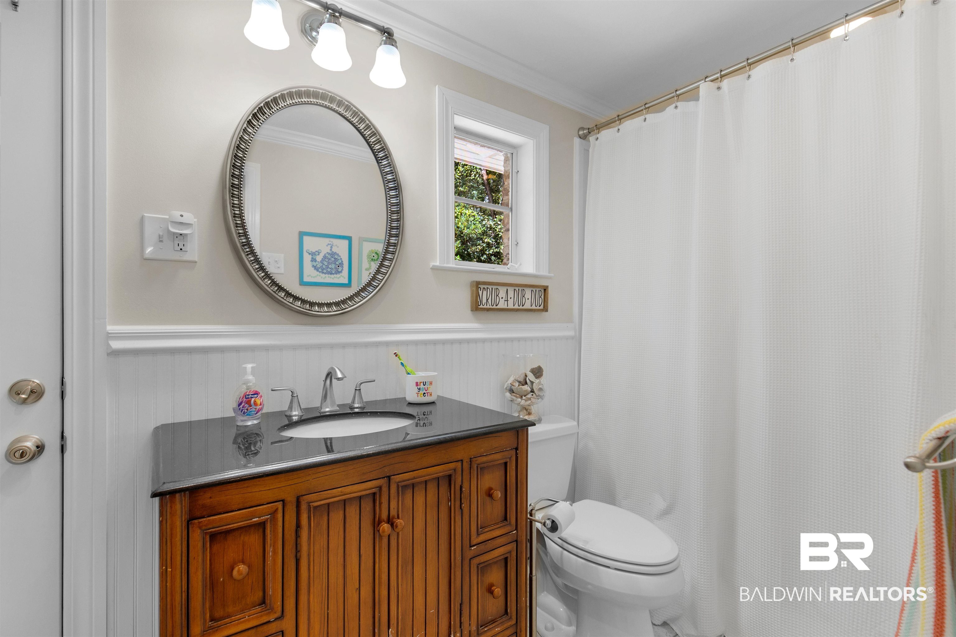 4306 Michael Boulevard Mobile, AL 36609 - Photo 24 of 35 Bathroom with walk in shower, vanity, crown molding, and toilet
