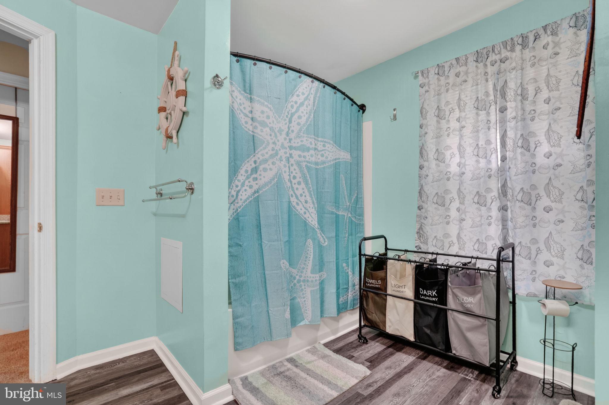 7278 Fleming Road New Church, VA 23415 - Photo 22 of 44 a bathroom with a shower and a sink