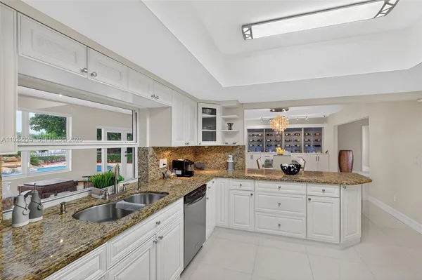 a view of dining room with furniture and a potted plant