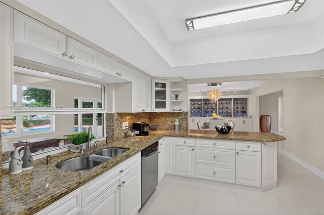 a view of dining room with furniture and a potted plant