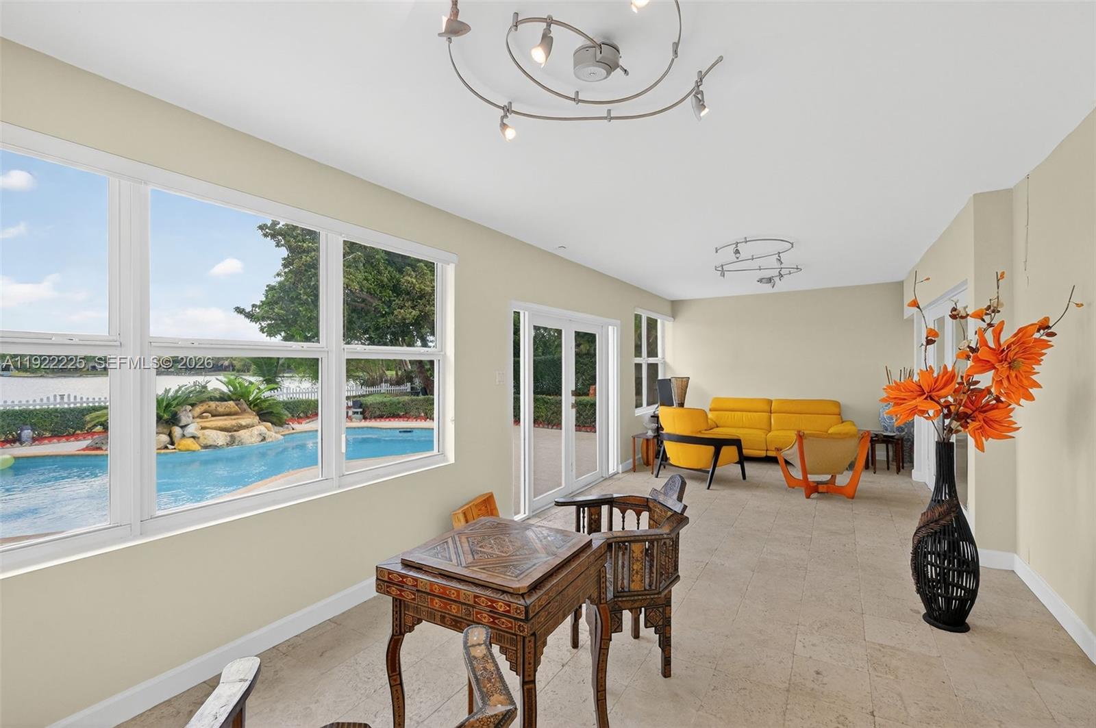 9261 Southwest 88th Street Miami, FL 33173 - Photo 17 of 55 a view of dining room with furniture and a potted plant