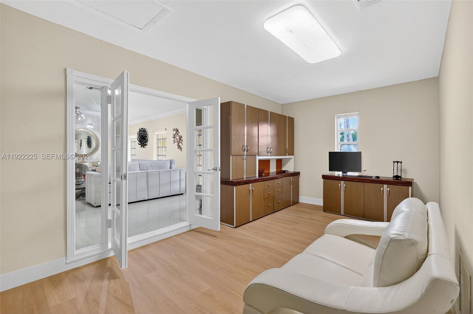 9261 Southwest 88th Street Miami, FL 33173 - Photo 22 of 55 a kitchen with stainless steel appliances kitchen island granite countertop furniture and a refrigerator