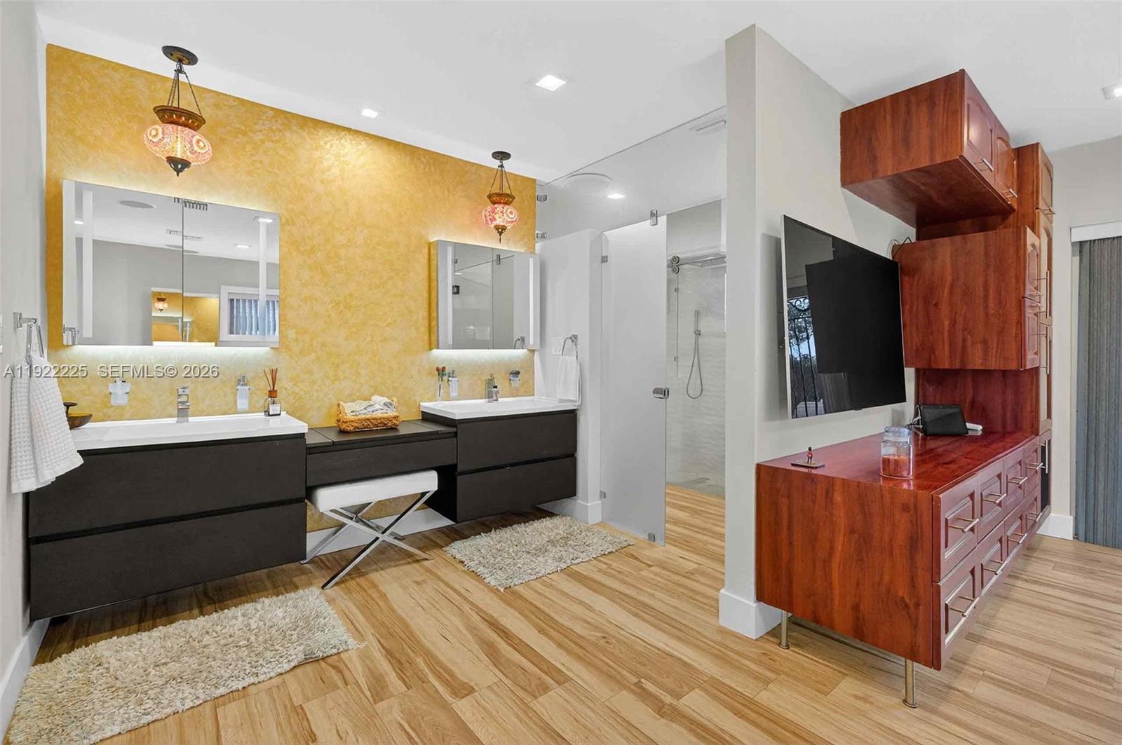 9261 Southwest 88th Street Miami, FL 33173 - Photo 33 of 55 a spacious bathroom with a tub sink and mirror