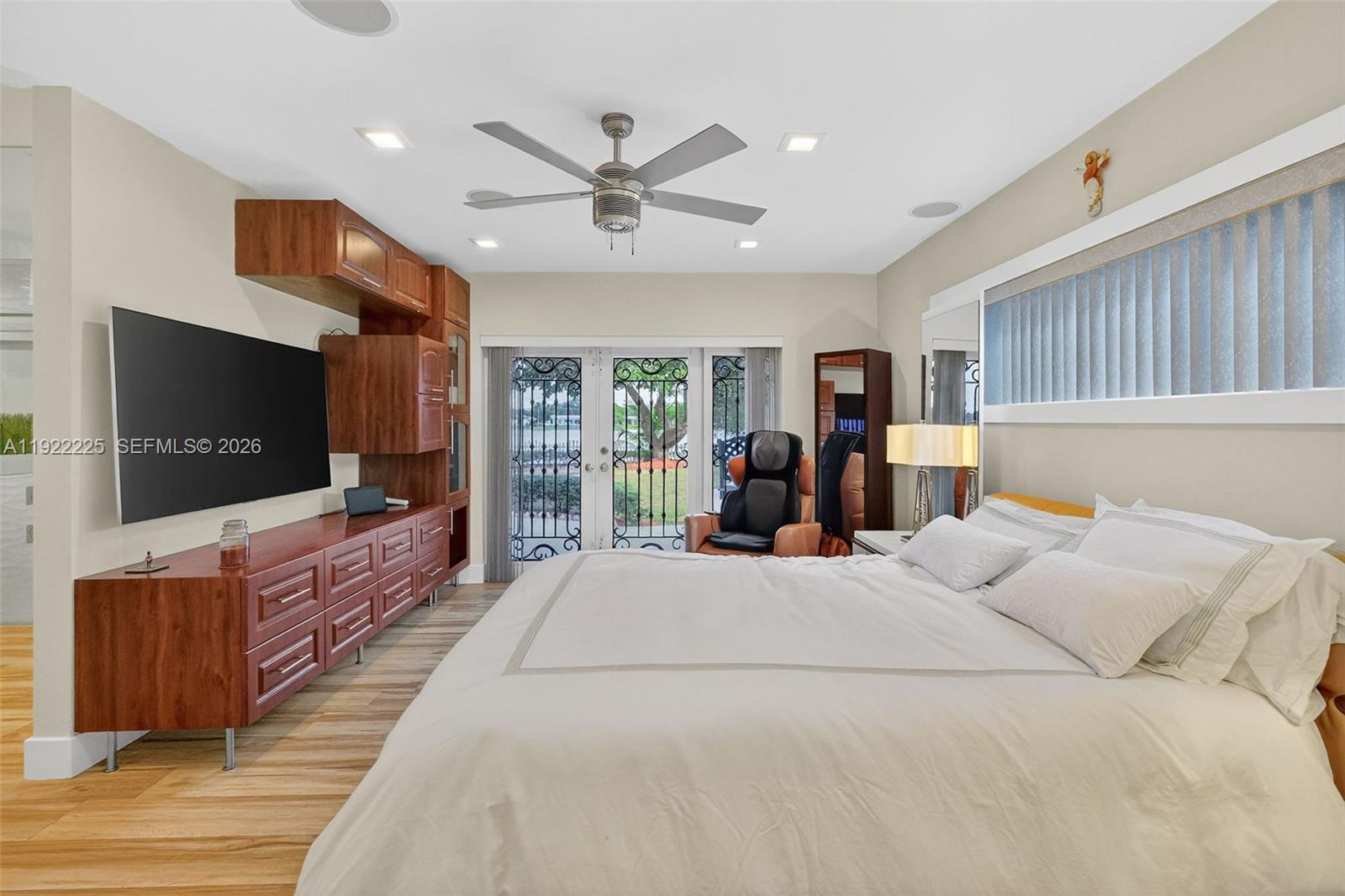 9261 Southwest 88th Street Miami, FL 33173 - Photo 34 of 55 a bed room with a bed a television and a large window