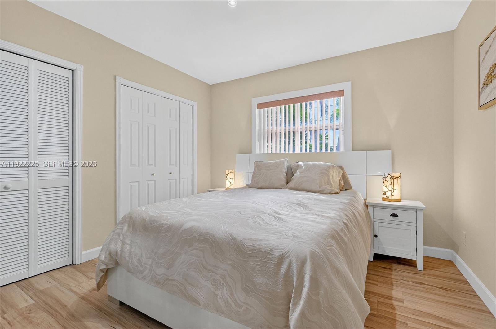 9261 Southwest 88th Street Miami, FL 33173 - Photo 38 of 55 a bedroom with a bed and a window