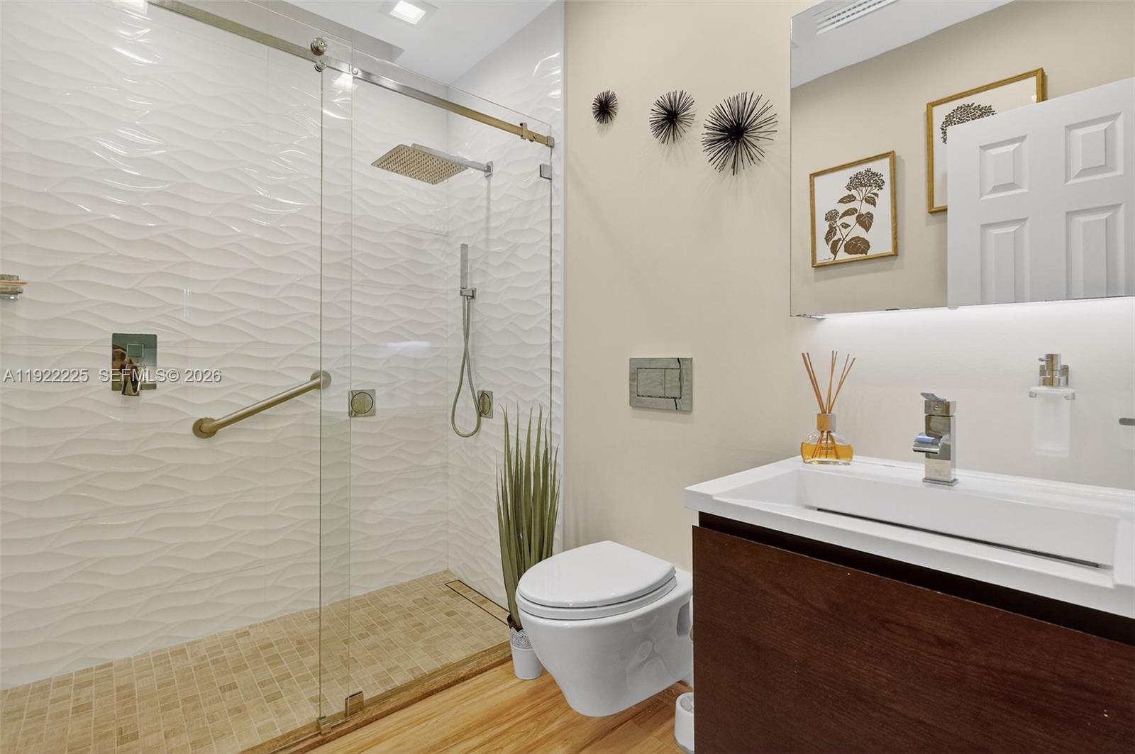 9261 Southwest 88th Street Miami, FL 33173 - Photo 39 of 55 a bathroom with a sink a toilet and shower