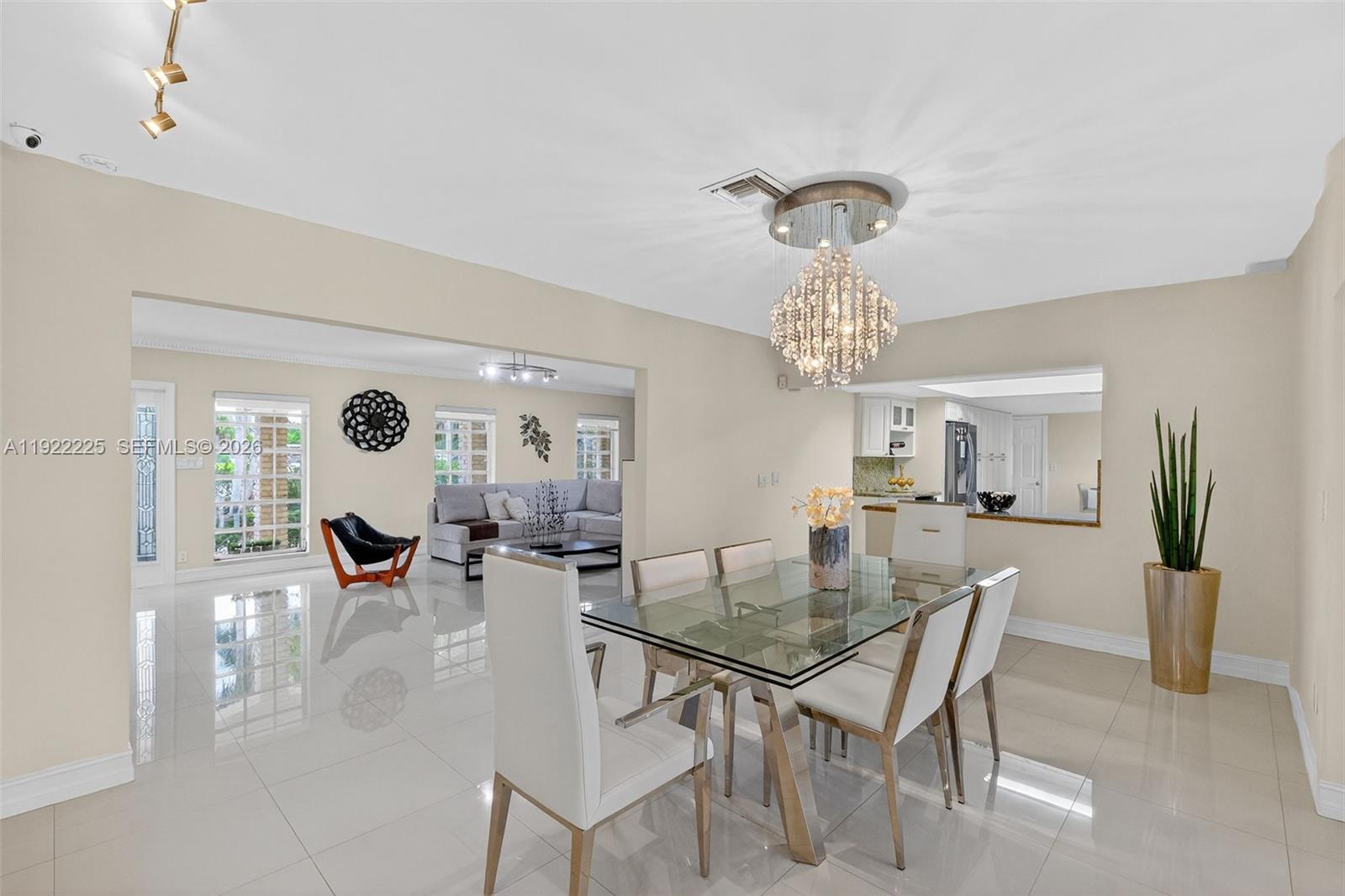 9261 Southwest 88th Street Miami, FL 33173 - Photo 4 of 55 a view of a dining room with furniture and chandelier