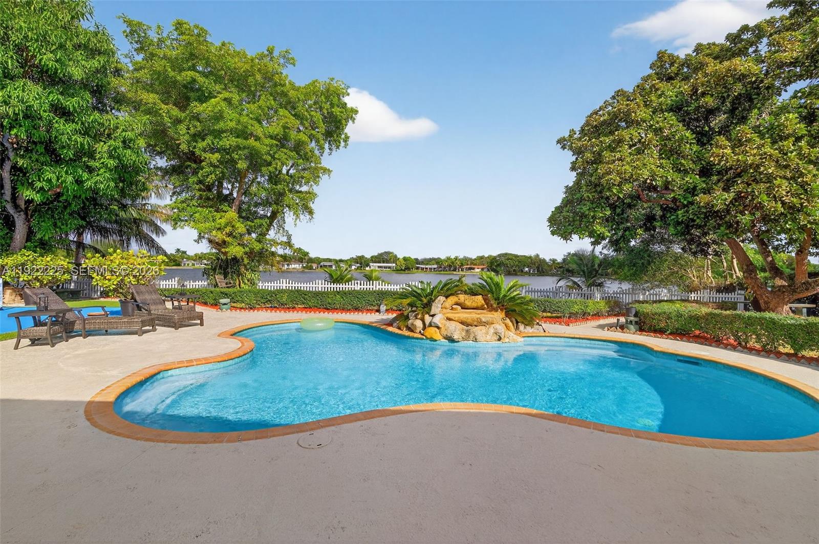 9261 Southwest 88th Street Miami, FL 33173 - Photo 42 of 55 a view of a swimming pool with an outdoor space