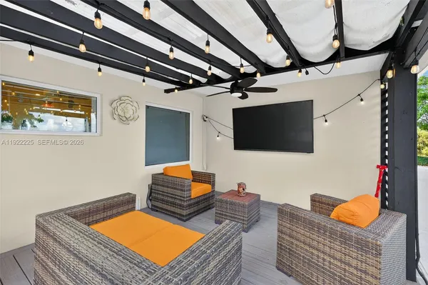 an aerial view of a house with yard swimming pool and outdoor seating