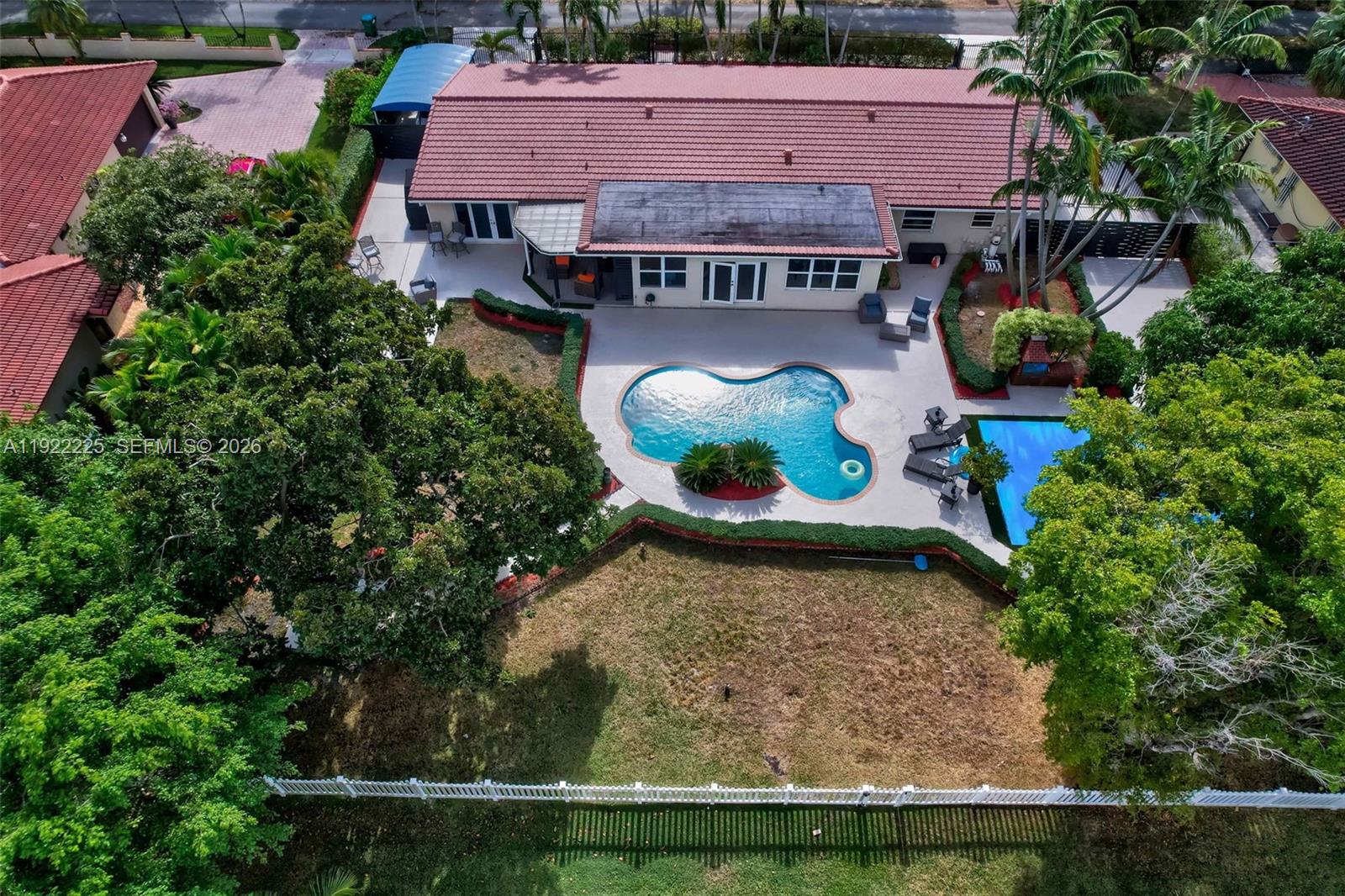 9261 Southwest 88th Street Miami, FL 33173 - Photo 48 of 55 an aerial view of a house with yard swimming pool and outdoor seating