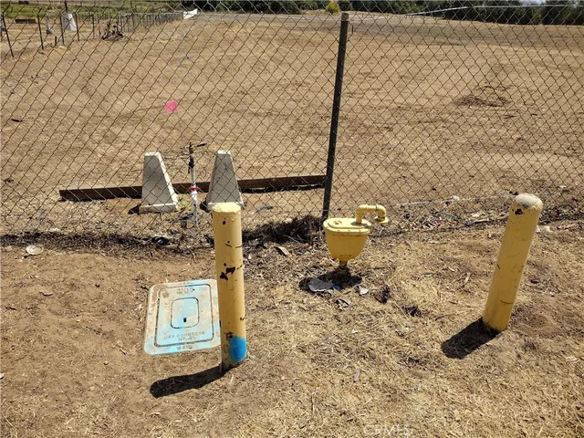 a view of a road and mountains in the background