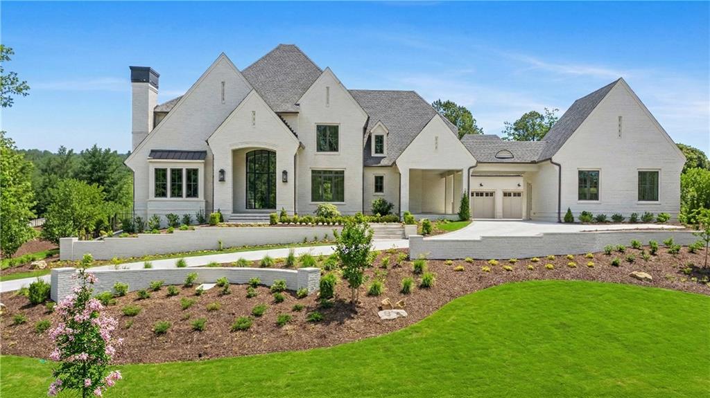 a front view of a house with garden