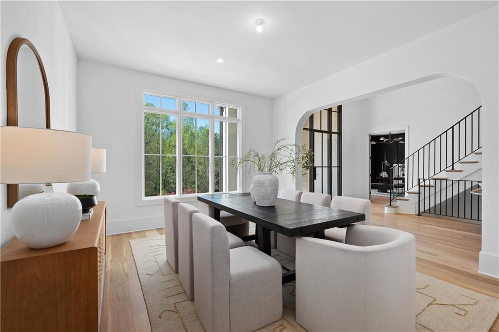 10210 Cedar Ridge Drive Milton, GA 30004 - Photo 12 of 47 a view of a dining room with furniture and wooden floor