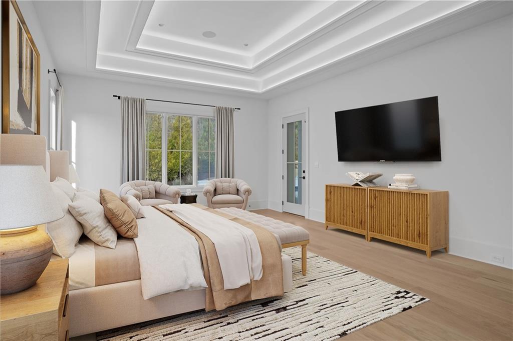 10210 Cedar Ridge Drive Milton, GA 30004 - Photo 12 of 24 a bedroom with a bed and a flat screen tv