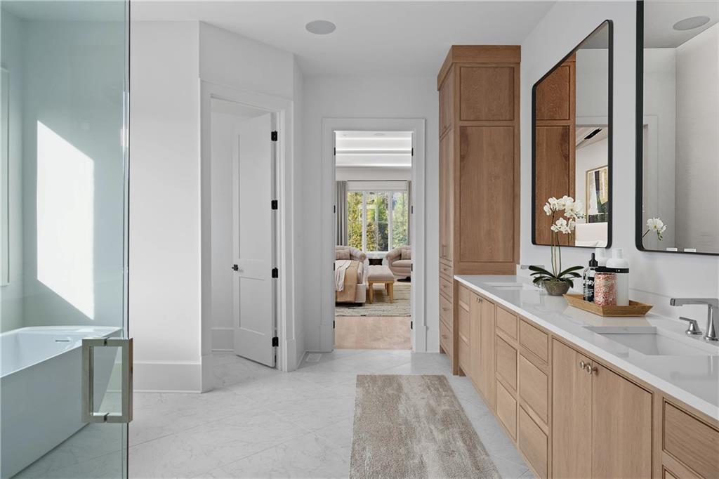 10210 Cedar Ridge Drive Milton, GA 30004 - Photo 13 of 24 a en suite bathroom with a double vanity sink and a mirror