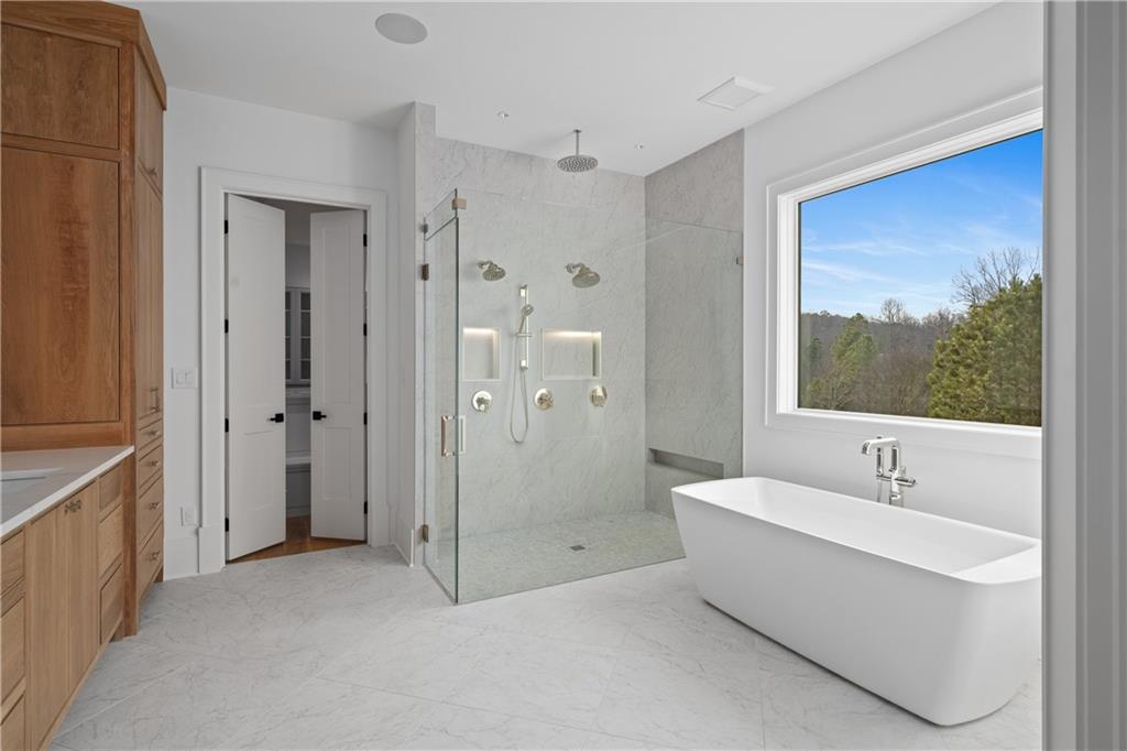 10210 Cedar Ridge Drive Milton, GA 30004 - Photo 14 of 24 a bathroom with a bathtub and a sink