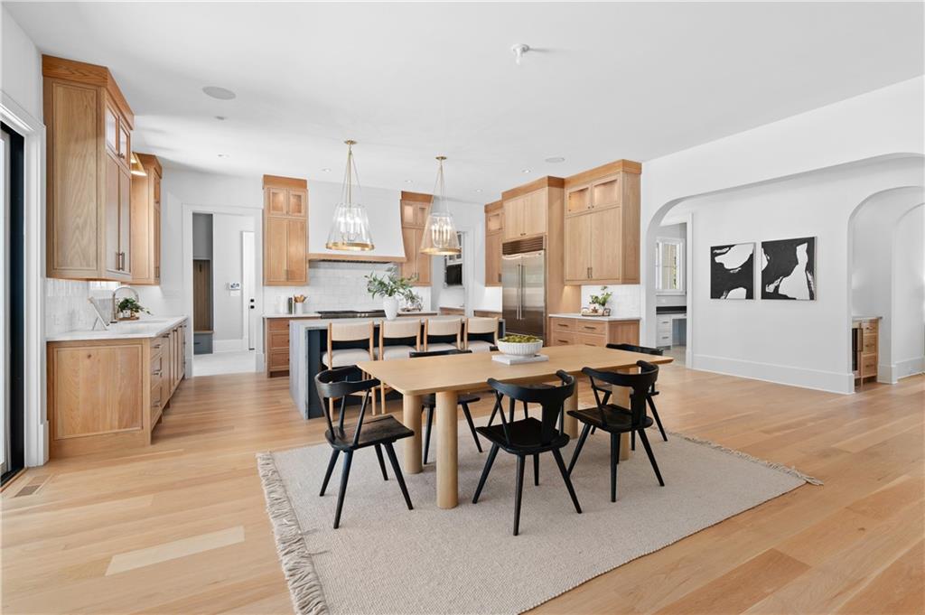 10210 Cedar Ridge Drive Milton, GA 30004 - Photo 16 of 47 a view of a dining room with furniture and wooden floor