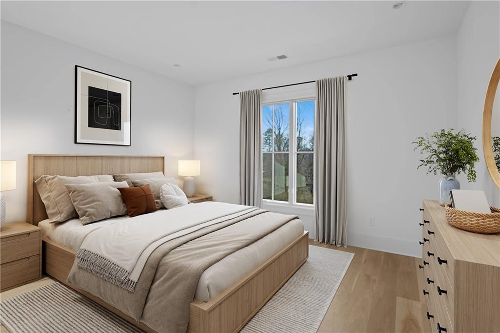 10210 Cedar Ridge Drive Milton, GA 30004 - Photo 17 of 24 a bedroom with a large bed and a potted plant