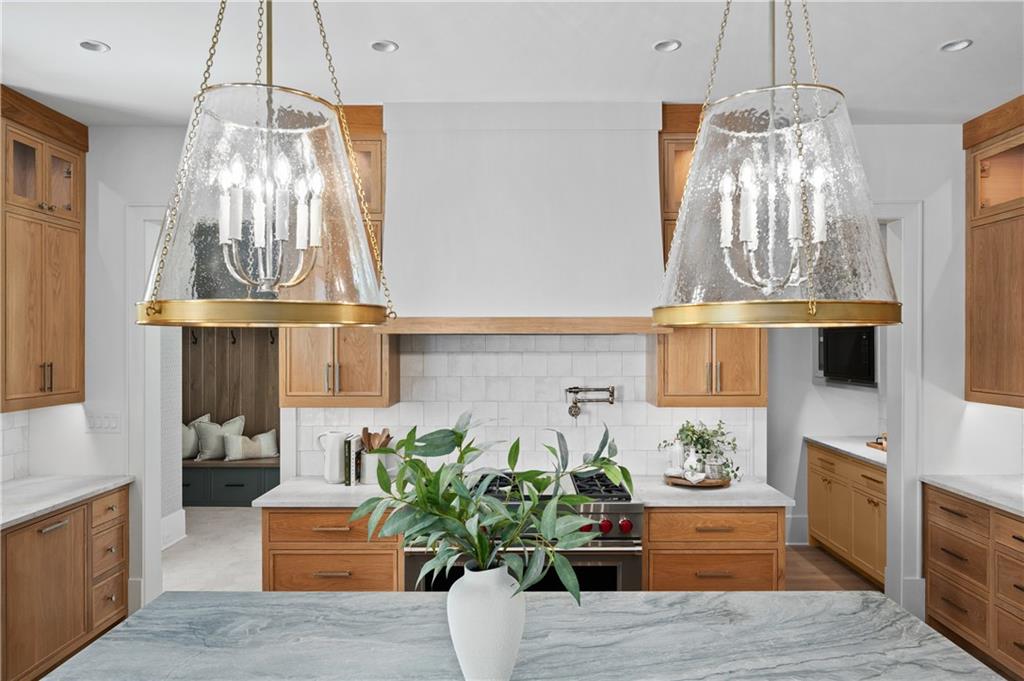 10210 Cedar Ridge Drive Milton, GA 30004 - Photo 18 of 47 a living room with fireplace furniture and a chandelier