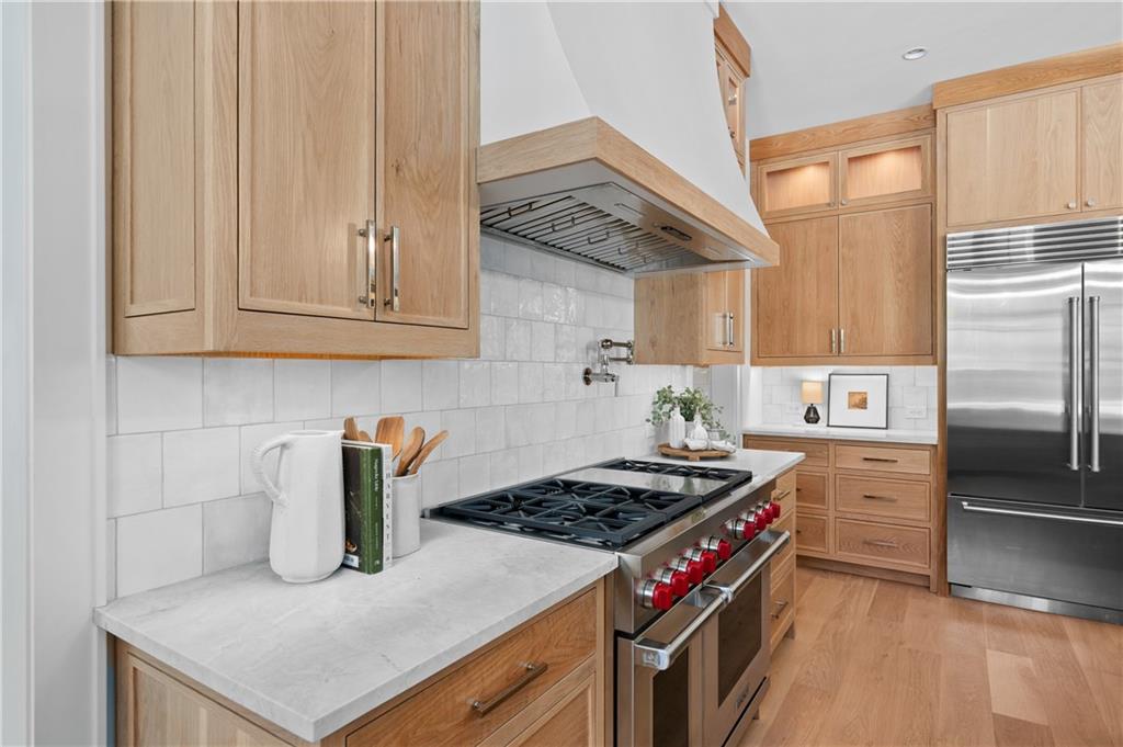 10210 Cedar Ridge Drive Milton, GA 30004 - Photo 20 of 47 a kitchen with a stove and a refrigerator