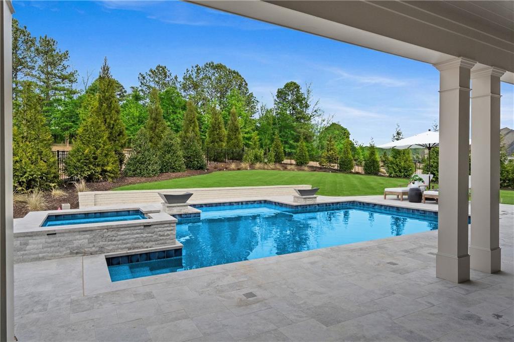 10210 Cedar Ridge Drive Milton, GA 30004 - Photo 2 of 24 a view of a swimming pool and outdoor space