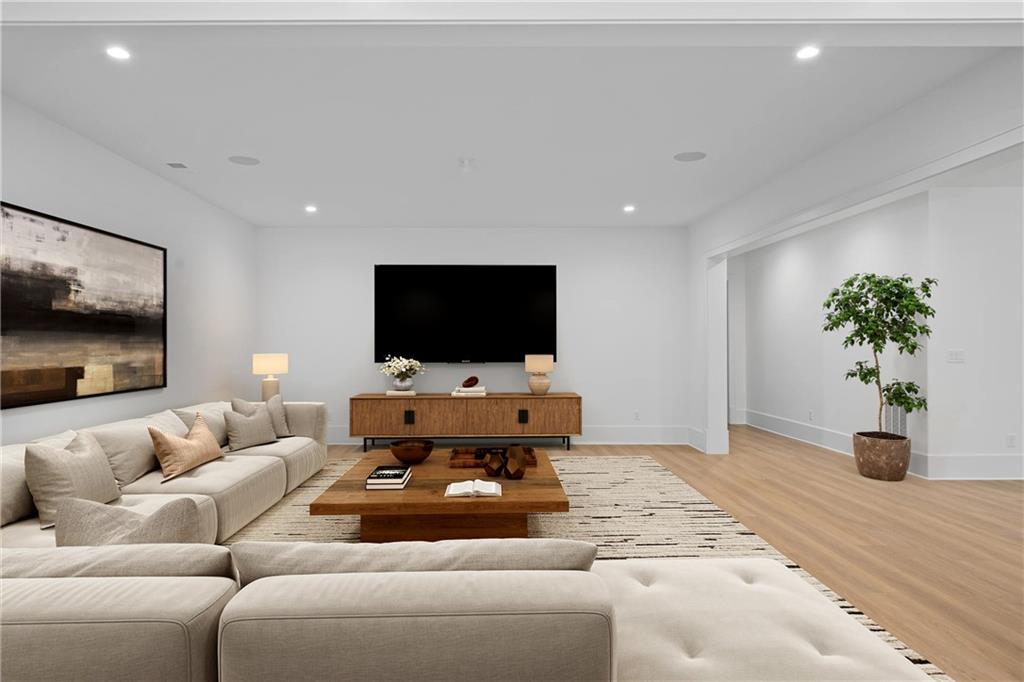 10210 Cedar Ridge Drive Milton, GA 30004 - Photo 21 of 24 a living room with furniture and a flat screen tv