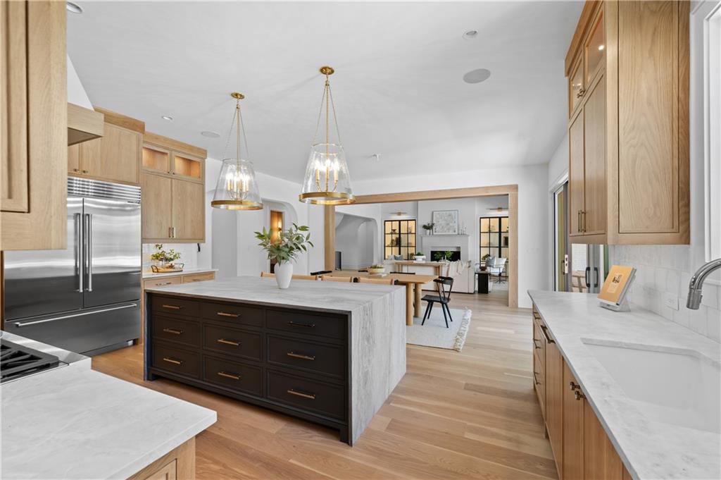 10210 Cedar Ridge Drive Milton, GA 30004 - Photo 21 of 47 a view of living room with granite countertop furniture and a chandelier