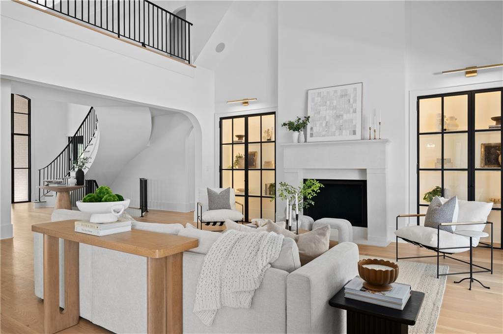 10210 Cedar Ridge Drive Milton, GA 30004 - Photo 24 of 47 a living room with furniture a fireplace and a table