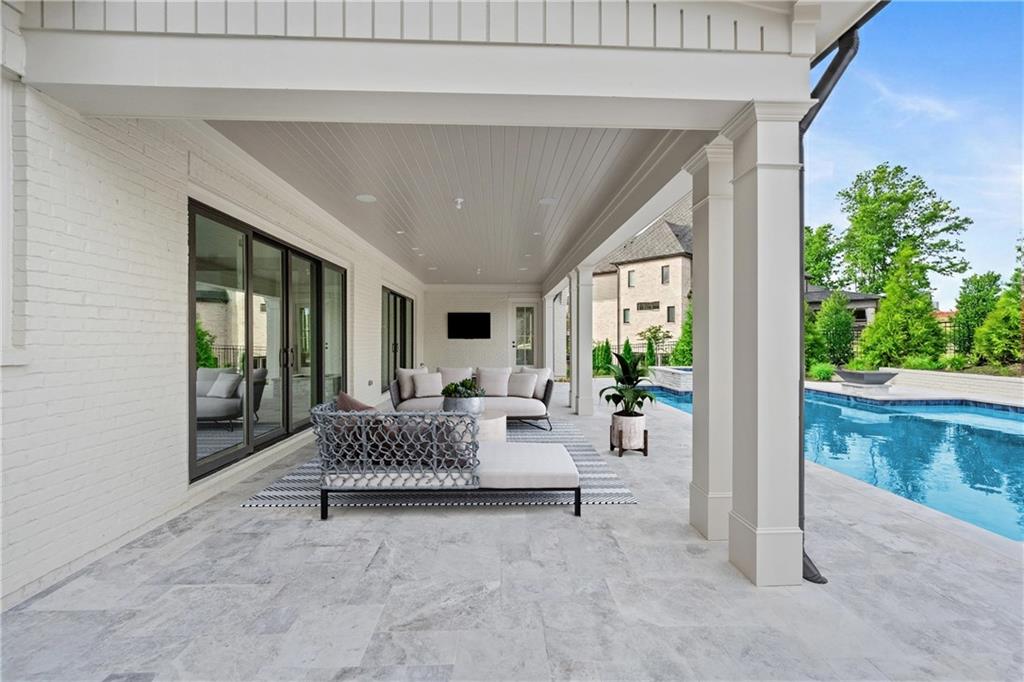 10210 Cedar Ridge Drive Milton, GA 30004 - Photo 24 of 24 a living room with furniture and a garden