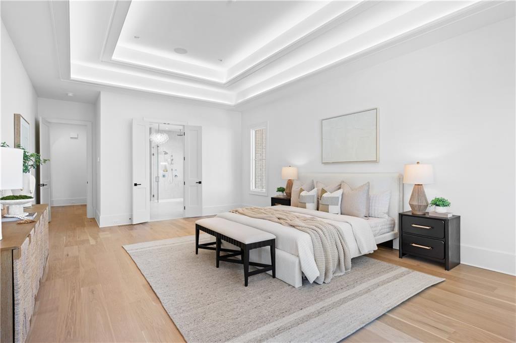 10210 Cedar Ridge Drive Milton, GA 30004 - Photo 27 of 47 a bedroom with a bed and a table