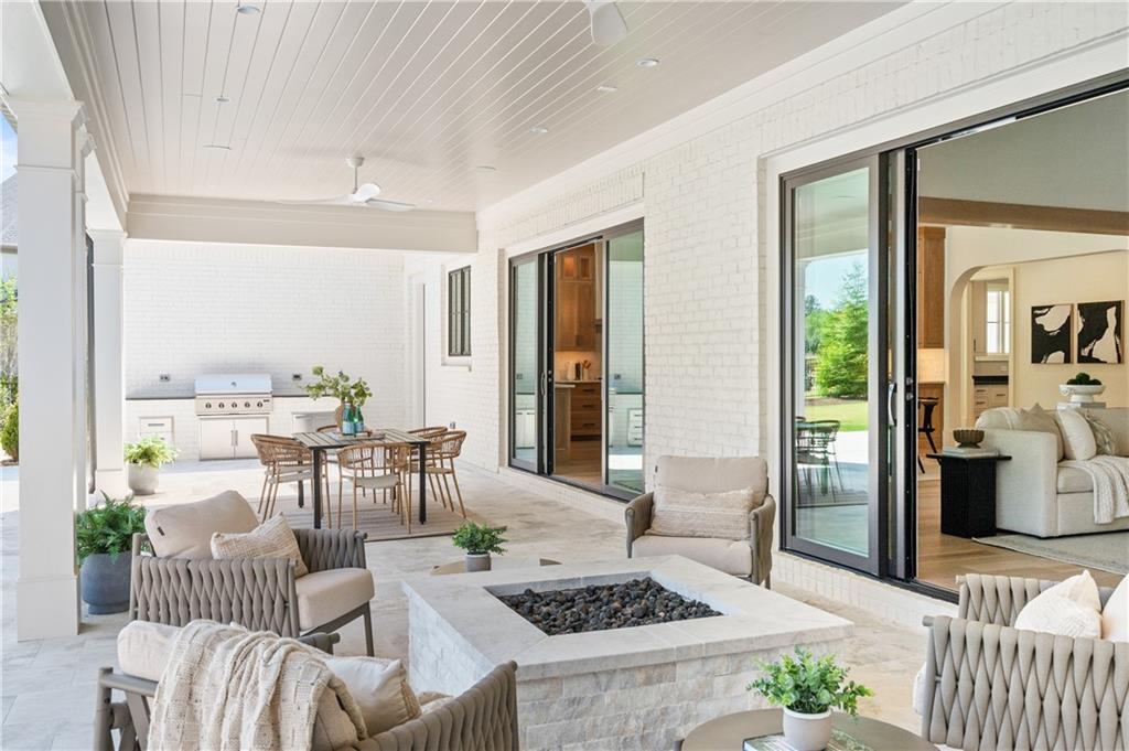 10210 Cedar Ridge Drive Milton, GA 30004 - Photo 3 of 47 a living room with furniture and a large window