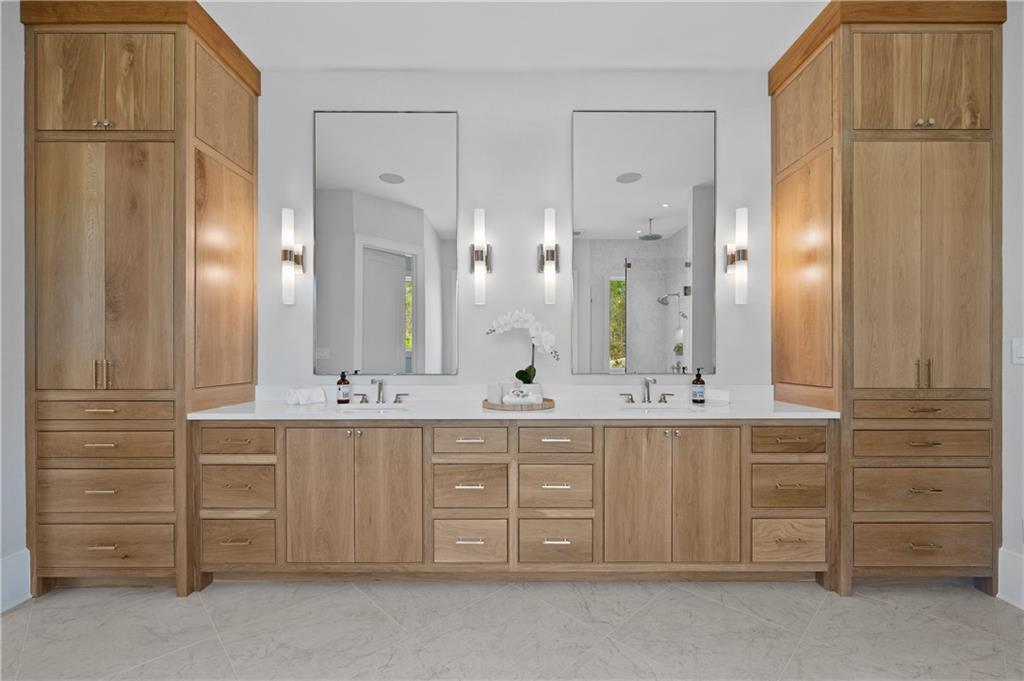 10210 Cedar Ridge Drive Milton, GA 30004 - Photo 32 of 47 a bathroom with a double vanity sink and a mirror