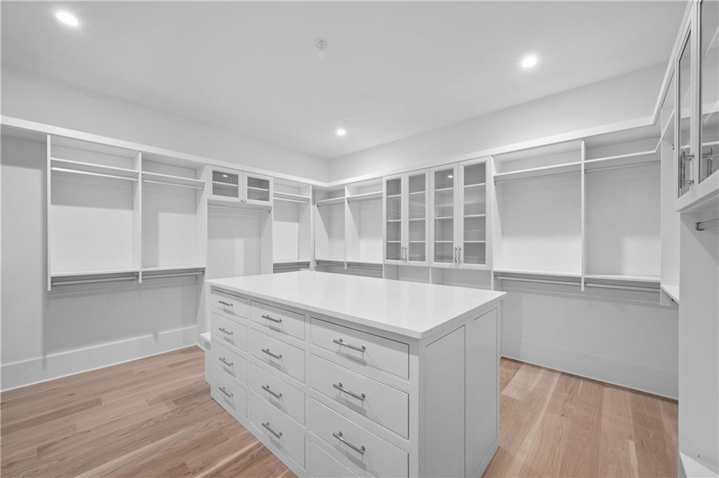 10210 Cedar Ridge Drive Milton, GA 30004 - Photo 33 of 47 a view of cabinets with wooden floor