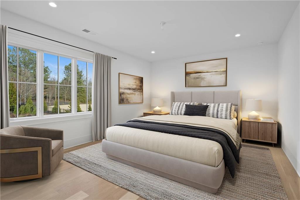 10210 Cedar Ridge Drive Milton, GA 30004 - Photo 35 of 47 a bedroom with a bed and a couch